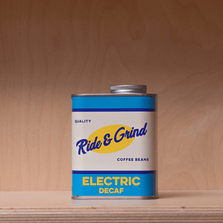 RIDE & GRIND ELECTRIC DECAF COLUMBIAN COFFEE BEANS TIN - DYKE & DEAN